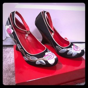 Sexy unique shoe with hand stiched flower design.